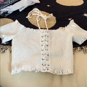 Fitted white crop top with laces